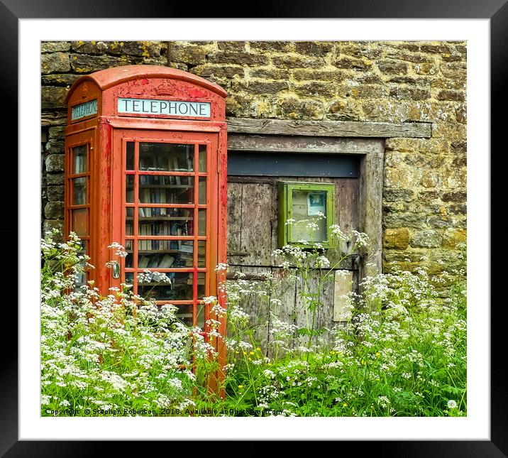 Old redundant red public telephone box or is it? Framed Mounted Print by Stephen Robinson