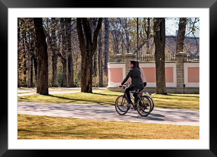 Riding A Bike In The Park Framed Mounted Print by Jukka Heinovirta