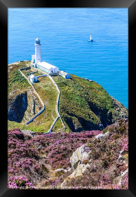 A yacht sails past the North Stack lighthouse Framed Print by Kevin Hellon