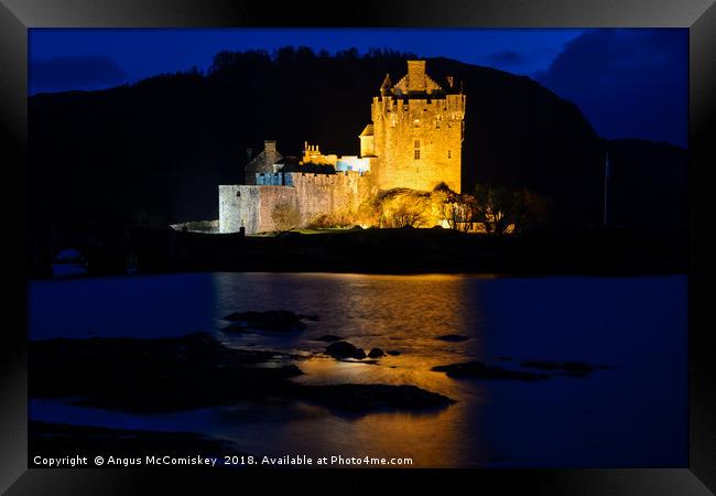 Eilean Donan Castle by night Framed Print by Angus McComiskey