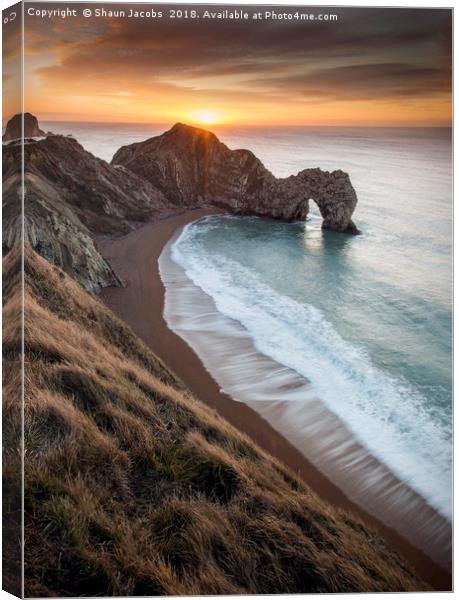 Warming Winter sunrise at Durdle Door  Canvas Print by Shaun Jacobs