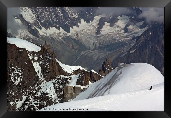 Lone climber in the Alps Framed Print by Colin Woods