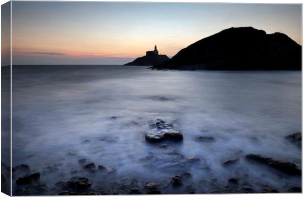 Mumbles lighthouse in silhouette Canvas Print by Leighton Collins