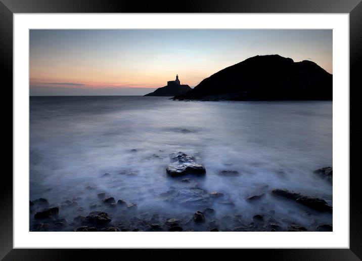 Mumbles lighthouse in silhouette Framed Mounted Print by Leighton Collins