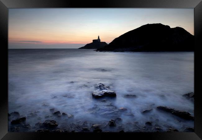 Mumbles lighthouse in silhouette Framed Print by Leighton Collins