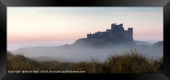 Bamburgh castle at dawn Framed Print by Brian Pain