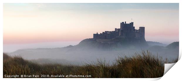 Bamburgh castle at dawn Print by Brian Pain