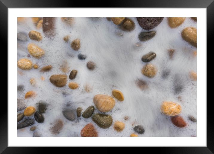 Pebbles washed by the tide. Framed Mounted Print by Bryn Morgan