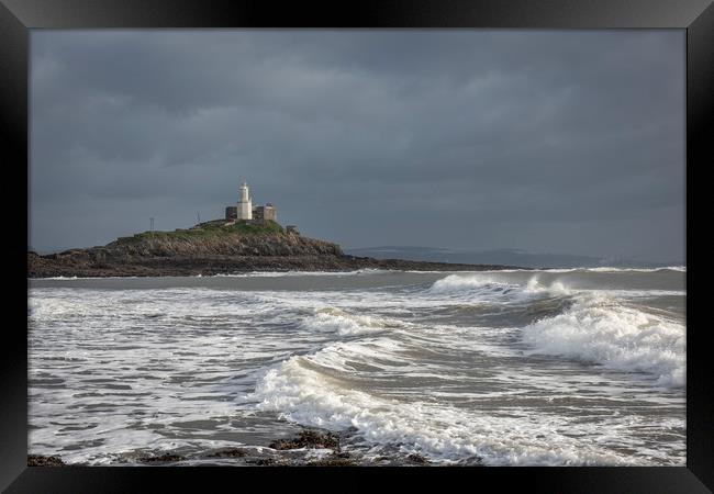 Mumbles lighthouse viewed from Bracelet bay. Framed Print by Bryn Morgan
