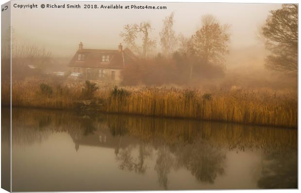 A cottage and reflection on misty winter's morning Canvas Print by Richard Smith