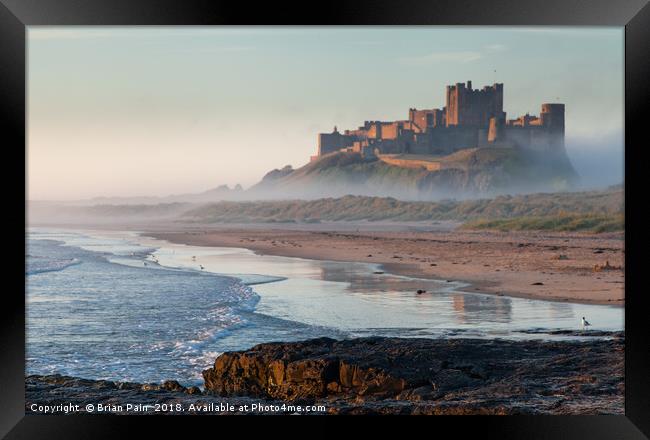 Dawn reflections of Bamburgh Framed Print by Brian Pain