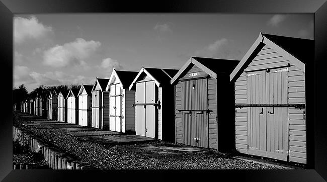 Black and White Beach Huts Framed Print by Louise Godwin