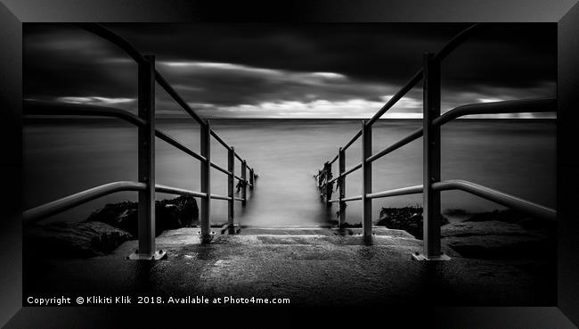 Railings into the water Framed Print by Angela H