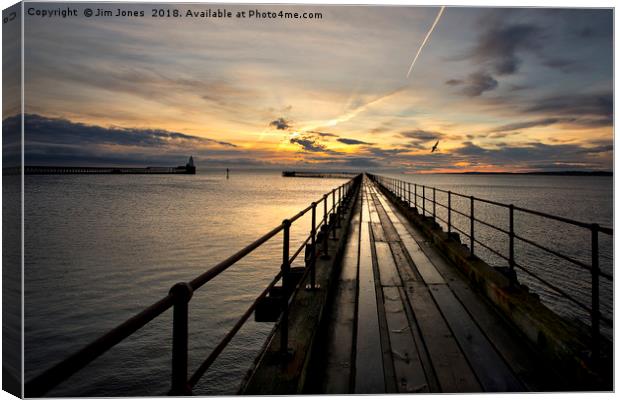 Sunrise over the Old Wooden Pier Canvas Print by Jim Jones