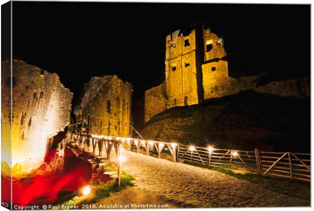 Corfe Castle at night in Winter Canvas Print by Paul Brewer