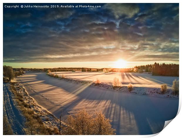 Sun Rising Over The Frozen River Print by Jukka Heinovirta