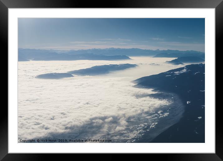 Mountains rising from the clouds Framed Mounted Print by Nick Hirst