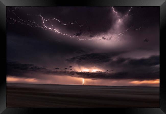 Lightning Lights up the sky over Colorado Framed Print by John Finney