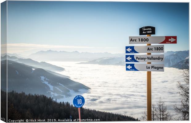 Les Arcs above a lake of clouds Canvas Print by Nick Hirst