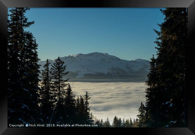Mountain above the clouds Framed Print by Nick Hirst