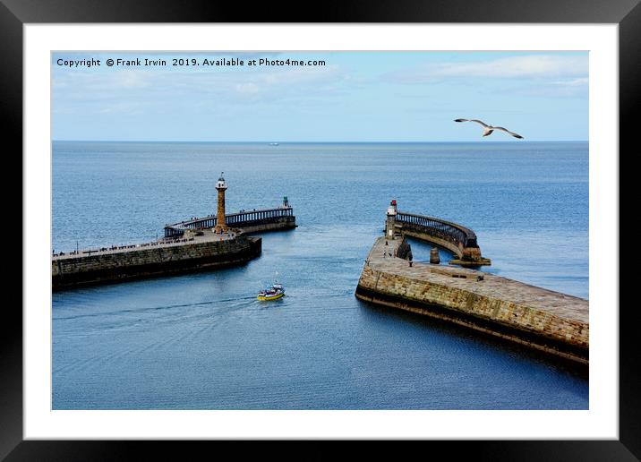 A small boat leaving Whitby Harbour Framed Mounted Print by Frank Irwin