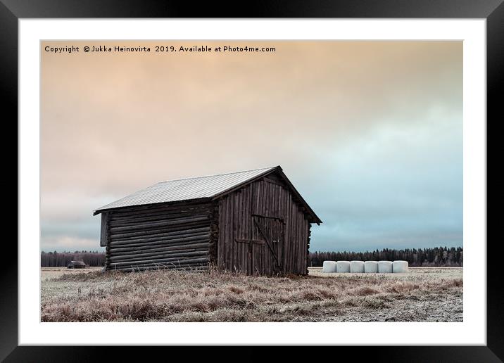 Old Barn On The Frosty Fields With White Bales Framed Mounted Print by Jukka Heinovirta
