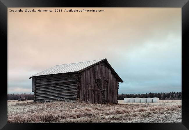 Old Barn On The Frosty Fields With White Bales Framed Print by Jukka Heinovirta
