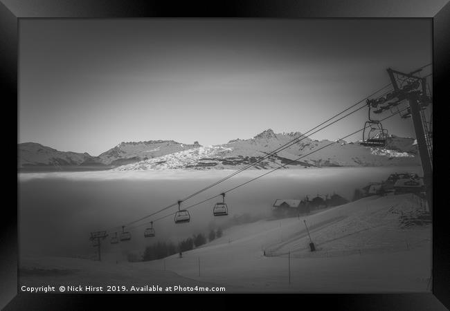 Chairlift rising out if the fog Framed Print by Nick Hirst