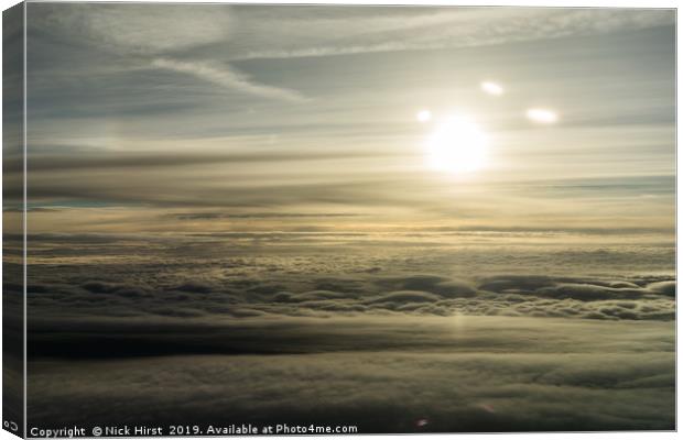 Sunrise form above the clouds Canvas Print by Nick Hirst
