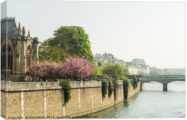 River Seine flowing past Notre Dame Canvas Print by Nick Hirst