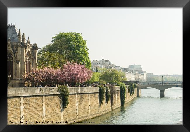 River Seine flowing past Notre Dame Framed Print by Nick Hirst