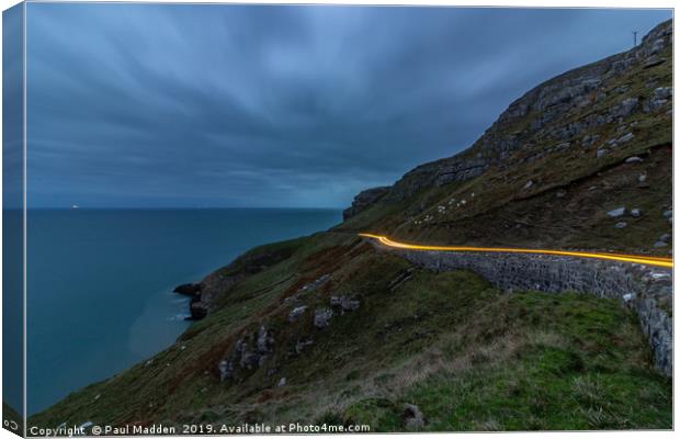 Car lights around the Great Orme Canvas Print by Paul Madden