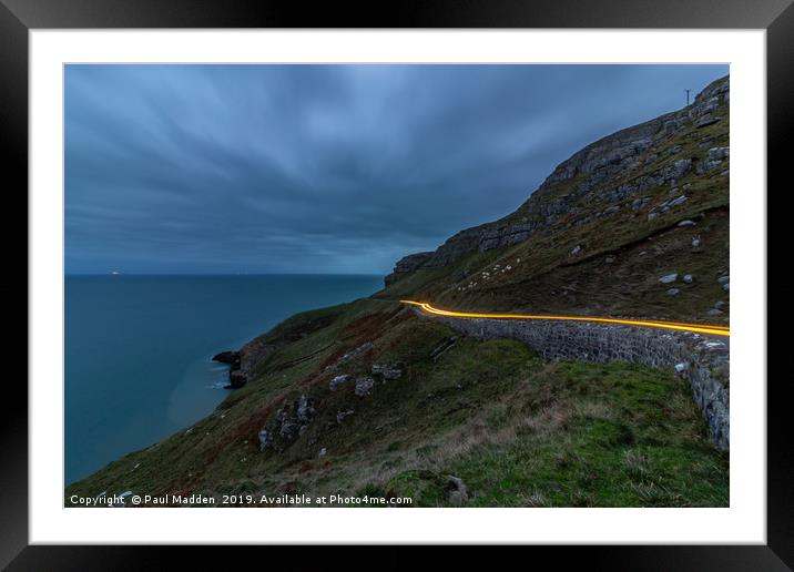 Car lights around the Great Orme Framed Mounted Print by Paul Madden
