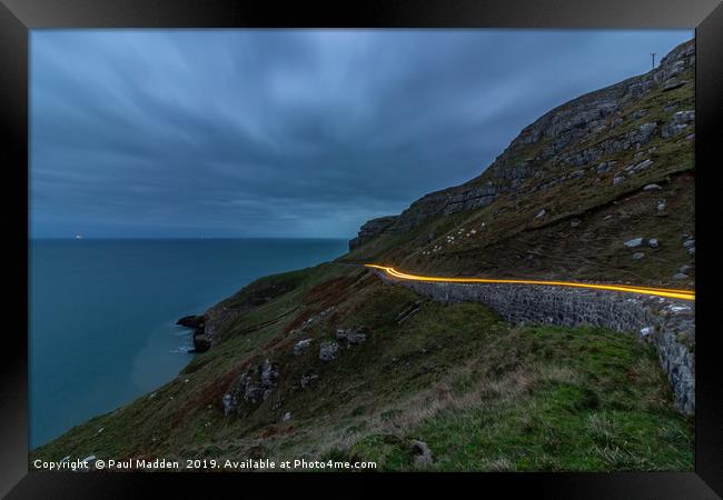 Car lights around the Great Orme Framed Print by Paul Madden