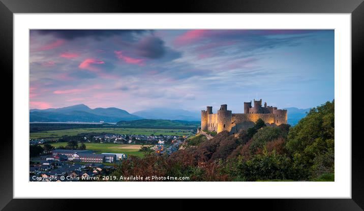 Harlech Castle at twilight with a pink sky sunset Framed Mounted Print by Chris Warren