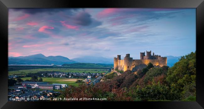 Harlech Castle at twilight with a pink sky sunset Framed Print by Chris Warren