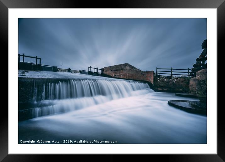 Slow Moving Water over the Weir Framed Mounted Print by James Aston
