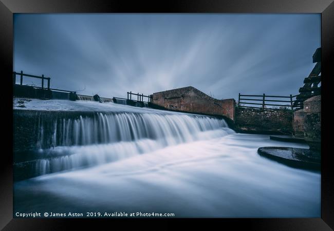 Slow Moving Water over the Weir Framed Print by James Aston