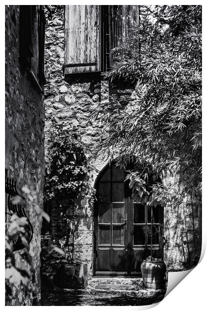 A Shadowy alley in Saint Paul de Vence France Print by Maggie McCall