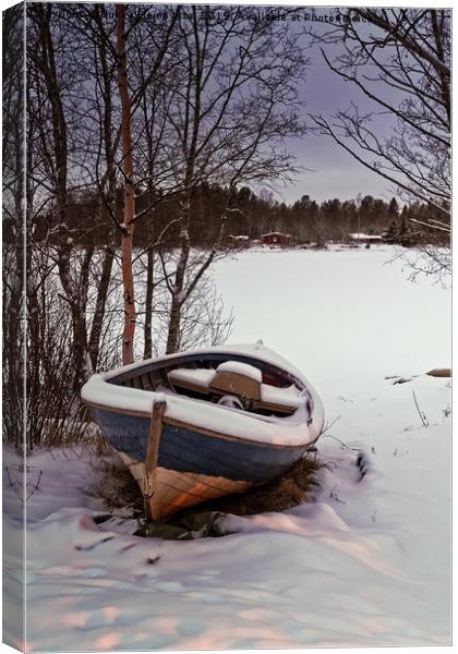 Fishing Boat Under Snow Canvas Print by Jukka Heinovirta