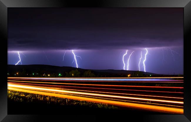Lightning light trails, New Mexico  Framed Print by John Finney