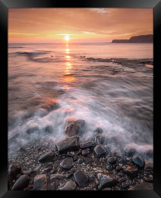 Pebbles on Kimmeridge bay at Sunset Framed Print by Kevin Browne