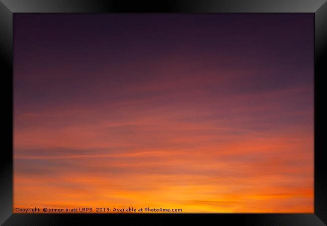 Stunning sunset colorful sky with wispy clouds Framed Print by Simon Bratt LRPS