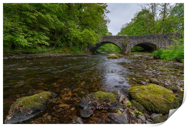 A bridge over the river Brathay Print by Images of Devon