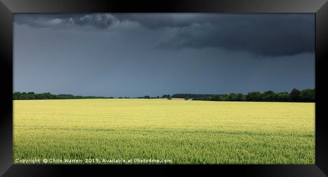 Crops under dark thunder skies  Framed Print by Chris Warren