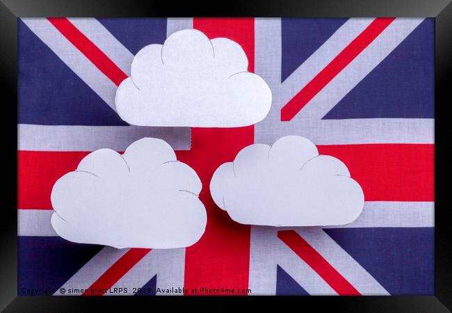 British flag with three white clouds floating abov Framed Print by Simon Bratt LRPS