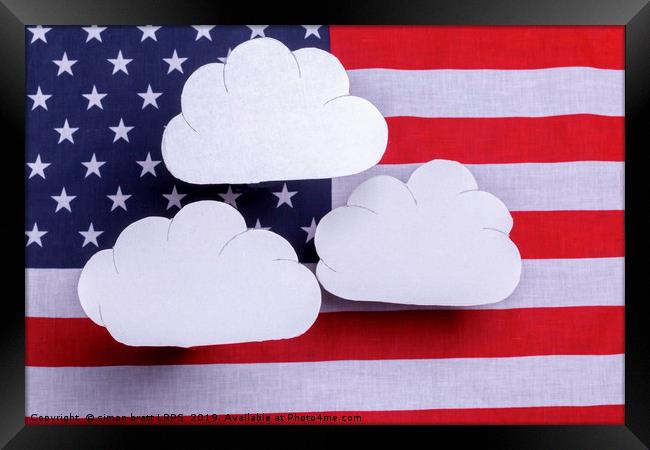American flag with three white clouds floating abo Framed Print by Simon Bratt LRPS