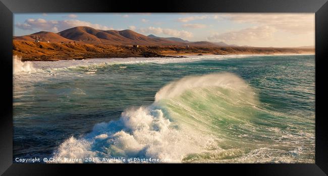 Wind blowing the surf at El Cotillo Fuerteventura  Framed Print by Chris Warren