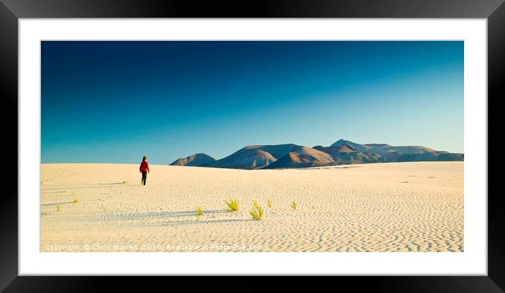 A lone figure walking on Sand dunes Corralejo  Framed Mounted Print by Chris Warren