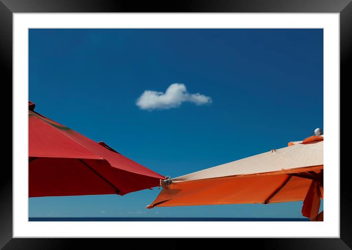 A solo cloud and parasols Framed Mounted Print by Leighton Collins